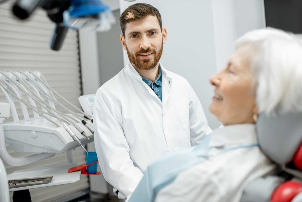 Dentist speaking with a patient.