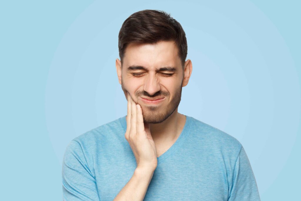 Man experiencing tooth pain.